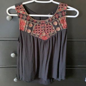 Red and black flow tank top with embroidered neck